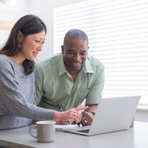 Happy couple planning monthly schedule and budget Finances FYI | DML | Embeddable Collection Sponsorship