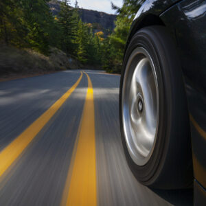 Black sports car motion country road. Car Care